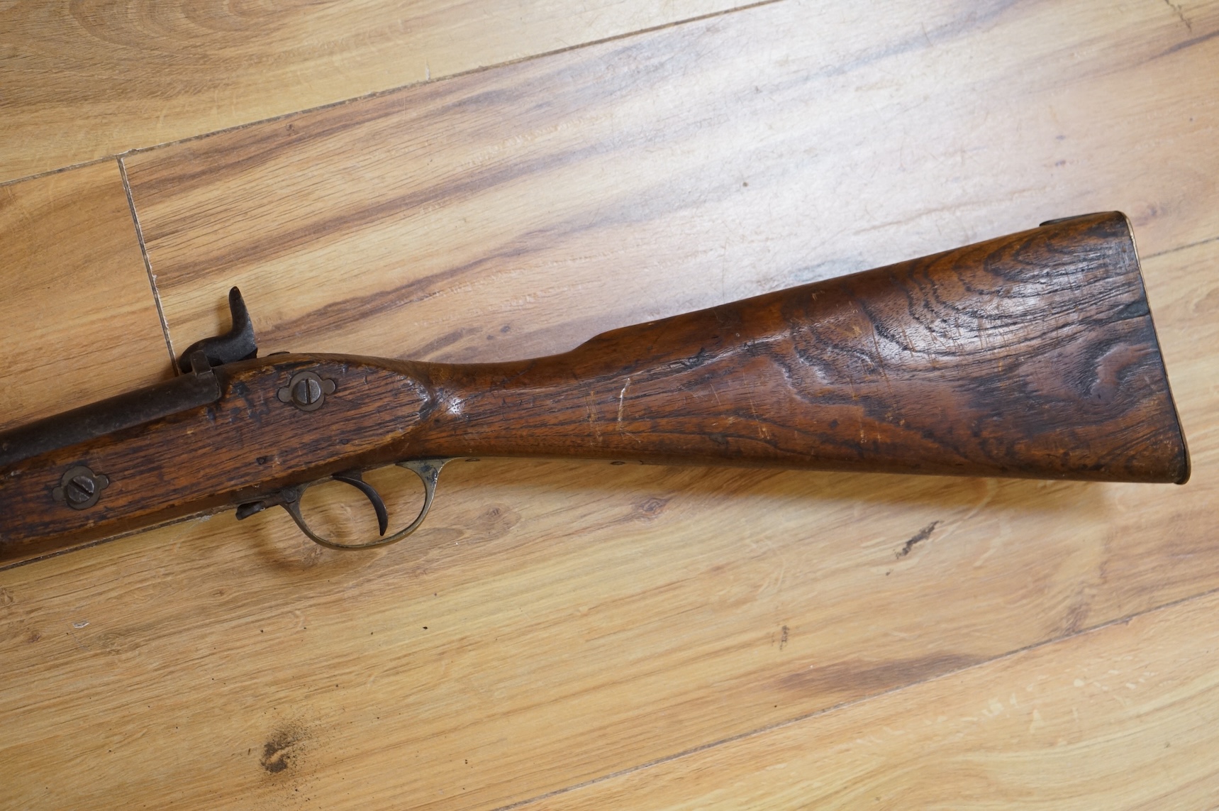 An Indian military style percussion musket, fully stocked, barrel 115cm, with military style brass mounts, iron barrel bands and Enfield style lock, partly 19th century